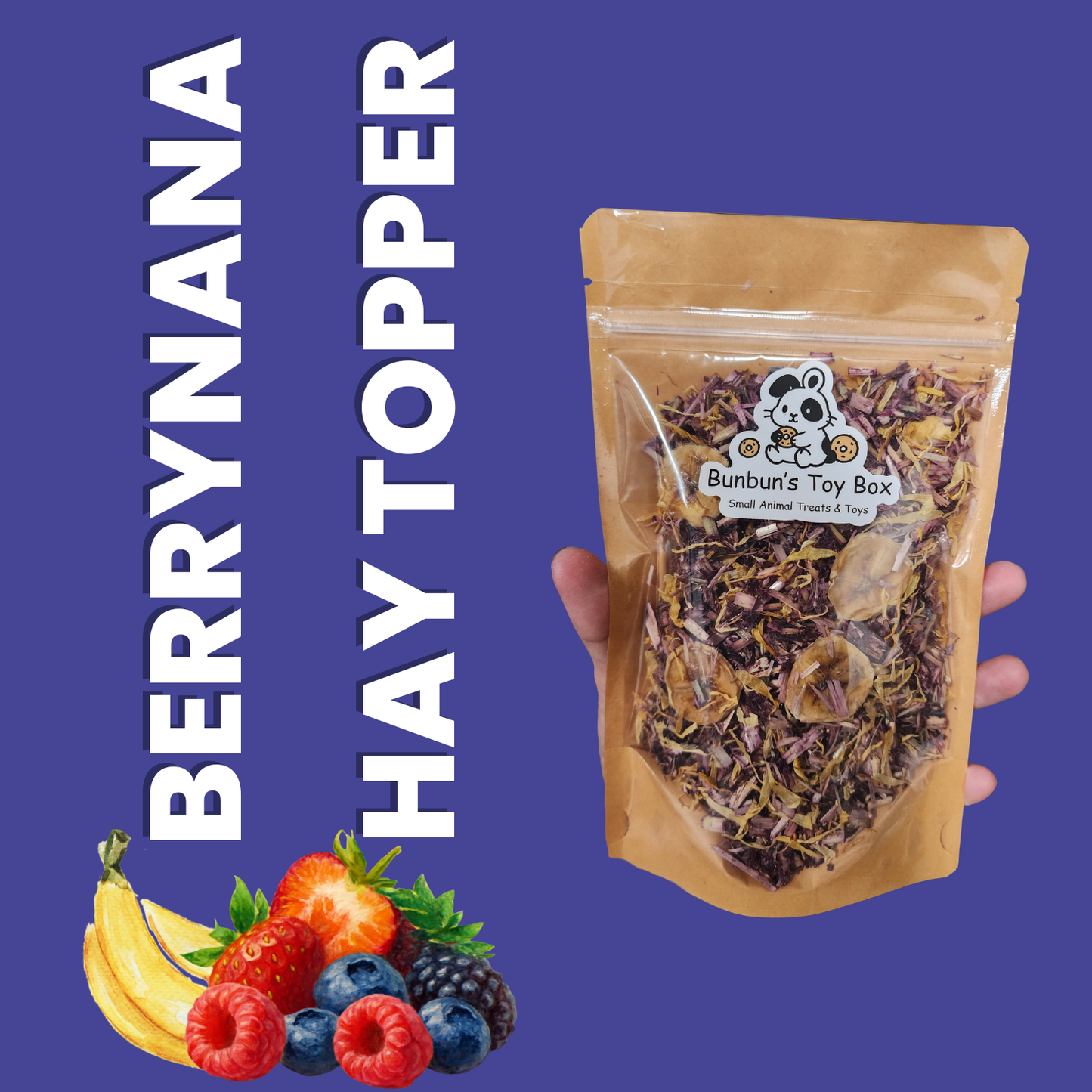 Berrynana Hay Topper package held by a hand with fruits on a blue background